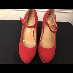 Barely worn high heel red shoes